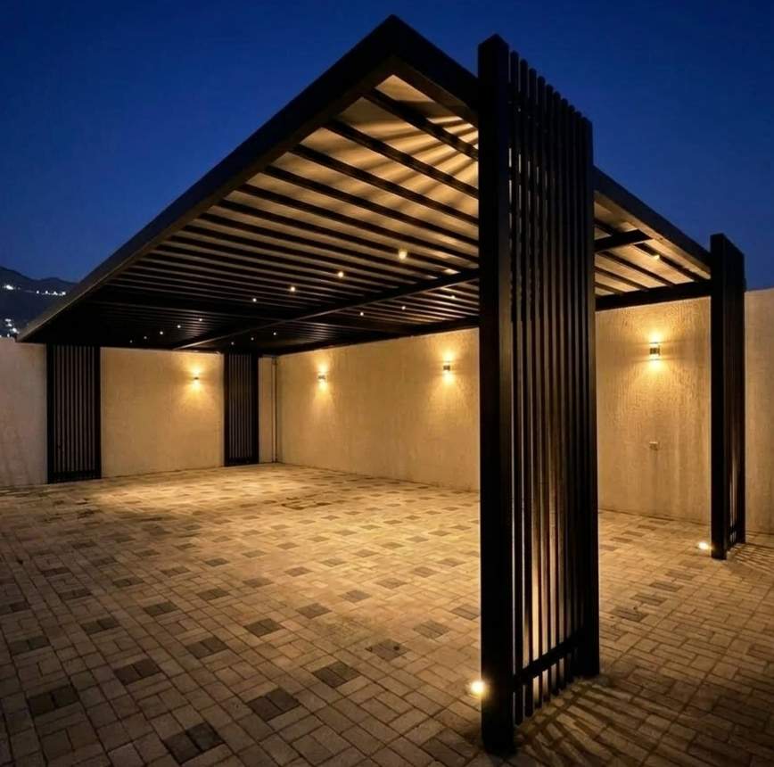 Custom black aluminum pergola shed with integrated LED strip lighting, showcasing a modern villa outdoor pergola design