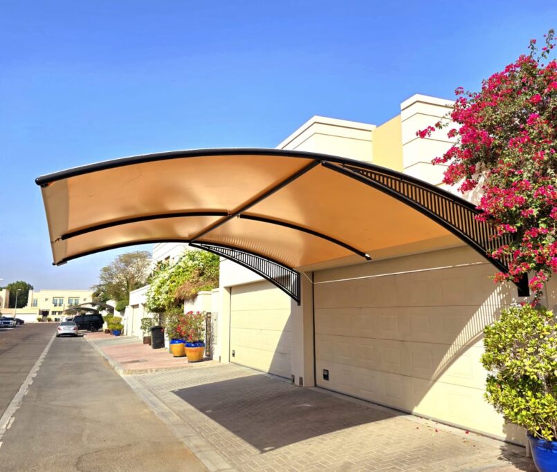Cantilevered beige carport structure installed by a leading car parking shade supplier in Dubai, designed by Pergola Shed