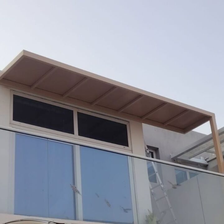 Modern beige canopy shade installed over a villa window in Damac Hills 2, Dubai