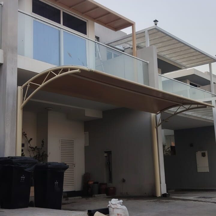 Protective arched car parking shade canopy installed for residential villa in Damac Hills 2